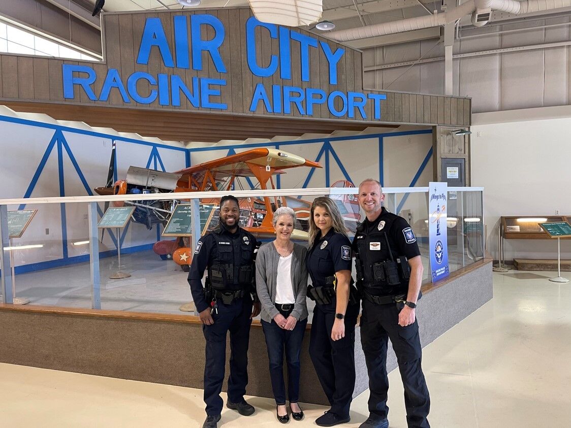 RPD Officers with Liz Powell, CEO of the Racine Community Foundation